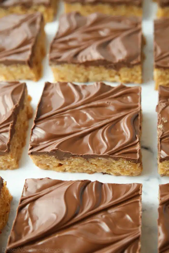 Squares of scotcharoos -- peanut butter rice krispie treats with a chocolate butterscotch topping.