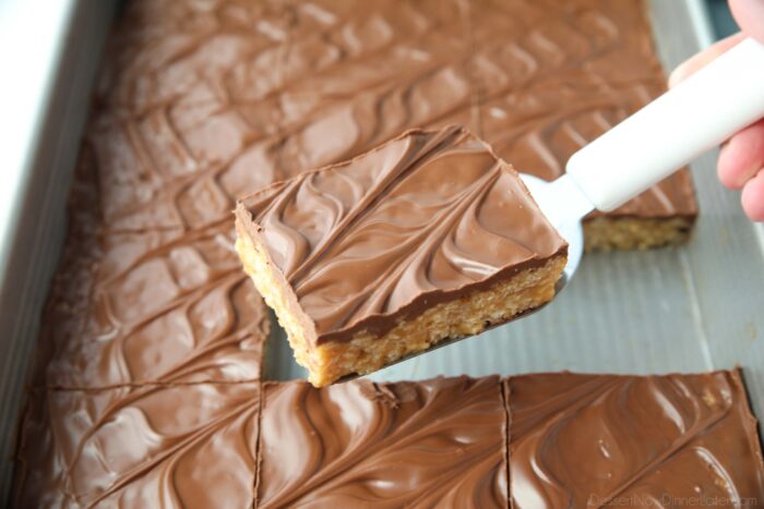 Scooping no bake scotcharoos (aka peanut butter rice krispie treats) out of the pan.