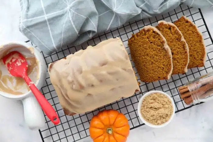 Pumpkin bread with cinnamon brown sugar glaze on top.