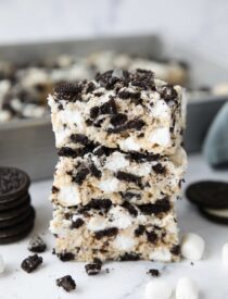 Stack of Oreo rice krispie treats with extra marshmallows and chunks of Oreo cookies.