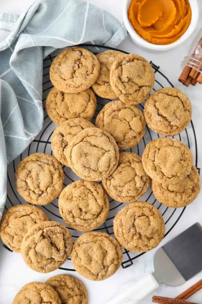 Cooling rack full of pumpkin gingersnap cookies.