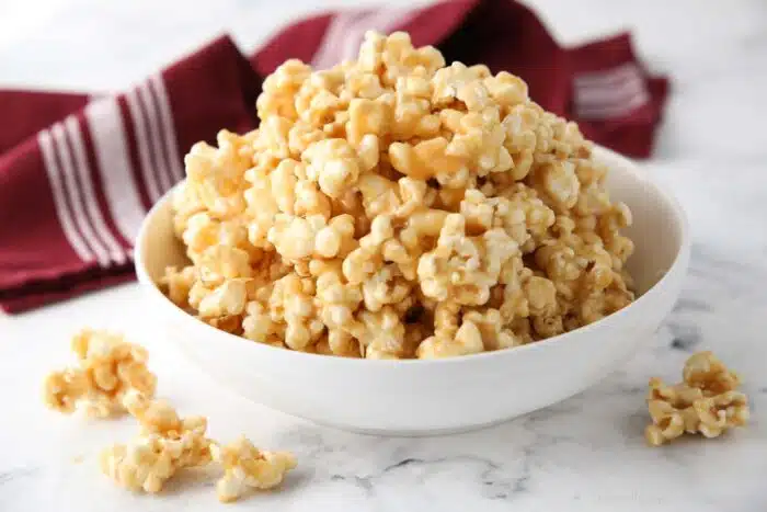 Bowl of soft and sticky caramel popcorn.