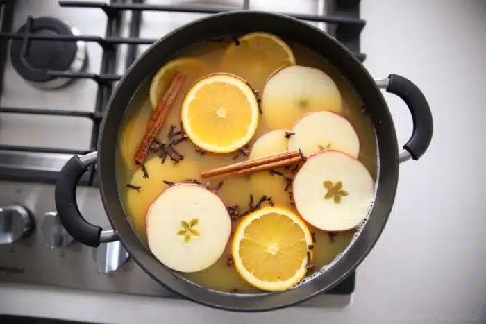 Wassail (mulled cider) being made on the stovetop. Can also put in crockpot.