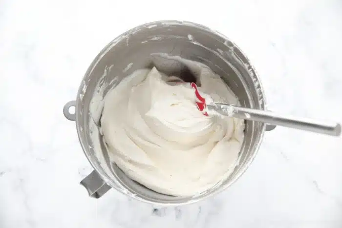 Bowl of whipped cream cheese frosting.
