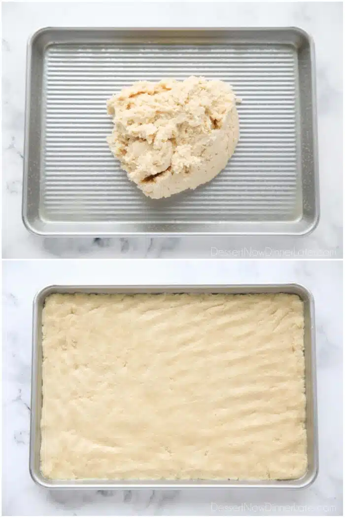 Sugar cookie dough being pressed into a 1/4 sheet pan (aka 9x13 pan).