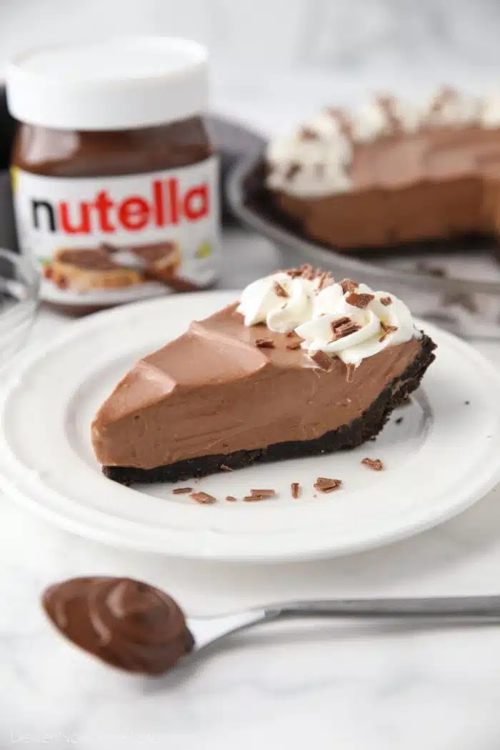 Slice of no bake Nutella cheesecake on a plate.
