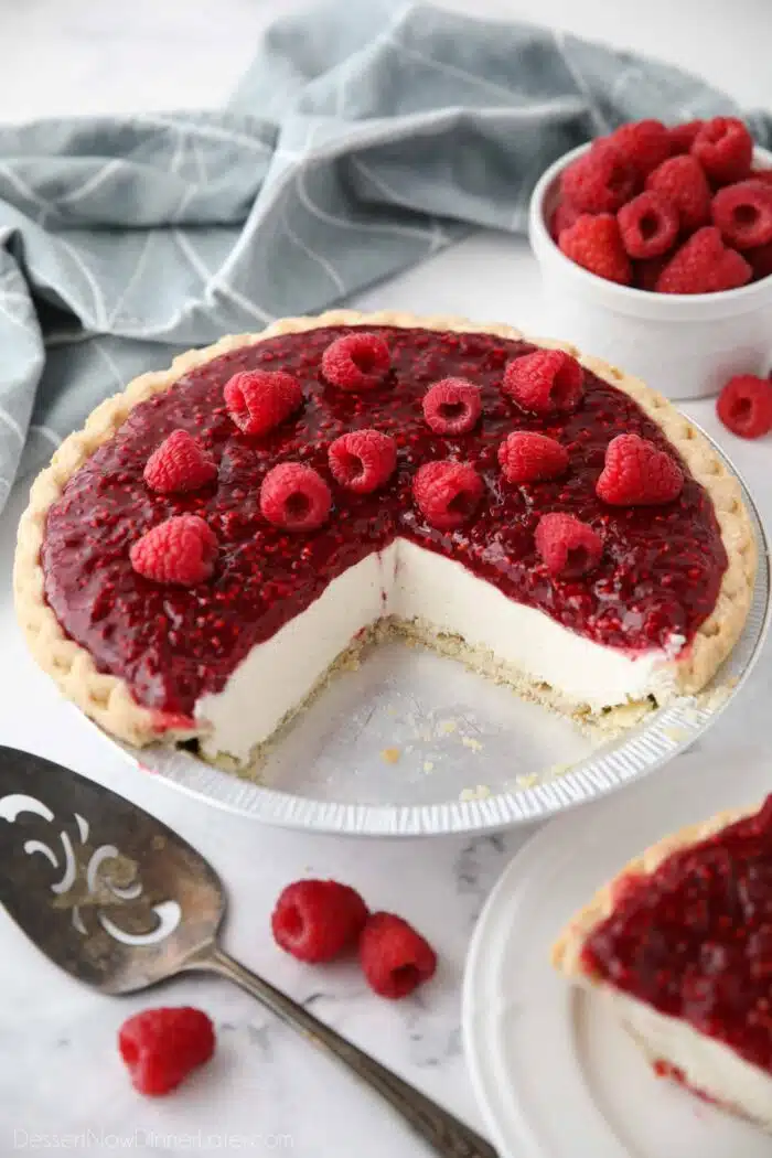 Slices removed from pie pan to show the inside of Raspberry Cream Cheese Pie.