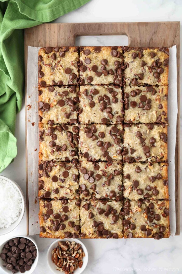 Top view of German Chocolate Bars cut into squares on a wooden cutting board.