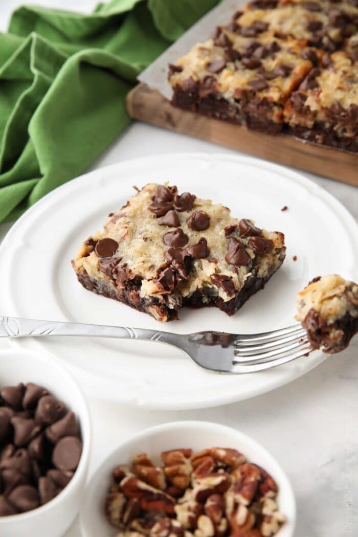 Forkful removed from a German Chocolate Bar on a plate.