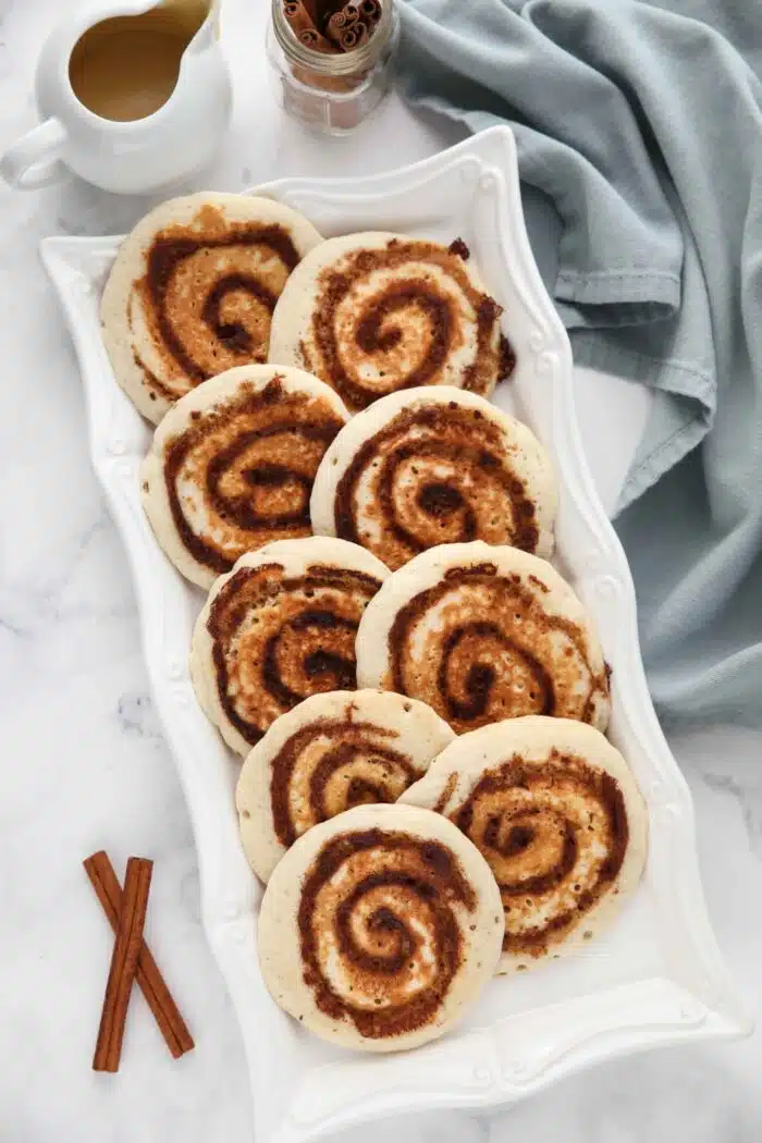 Platter of pancakes with a cinnamon swirl.