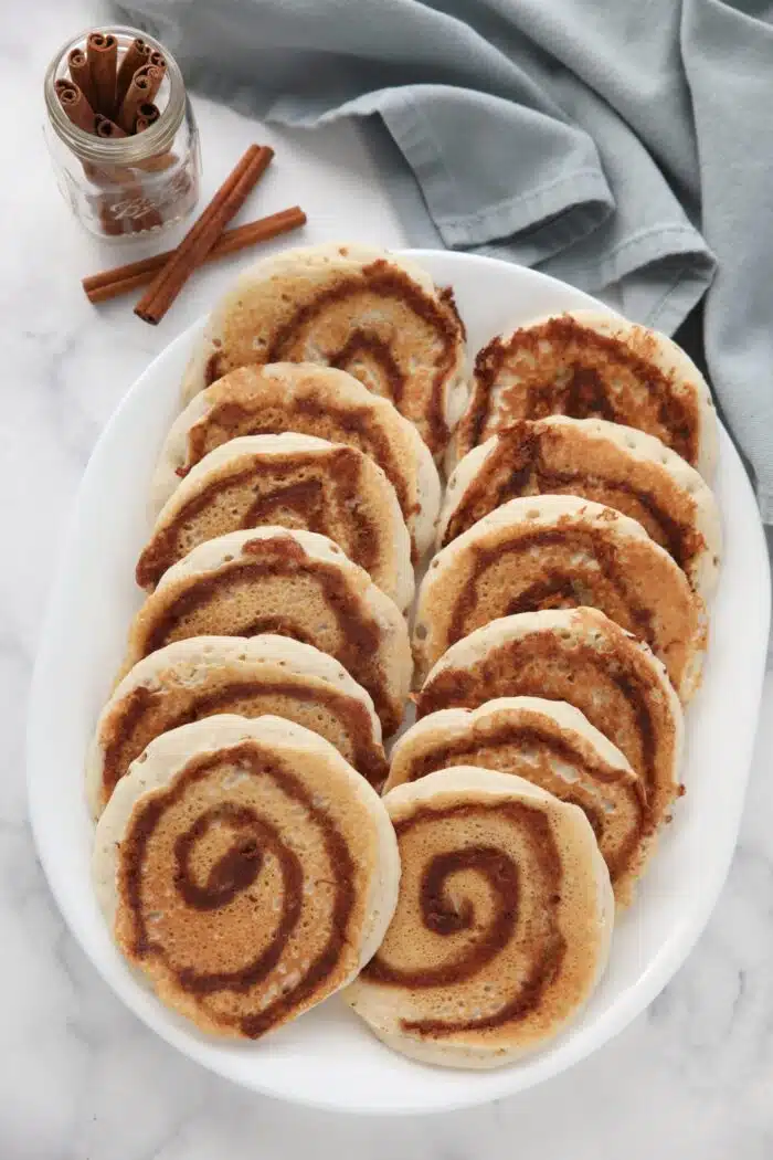 Cinnamon swirl pancakes on a platter.