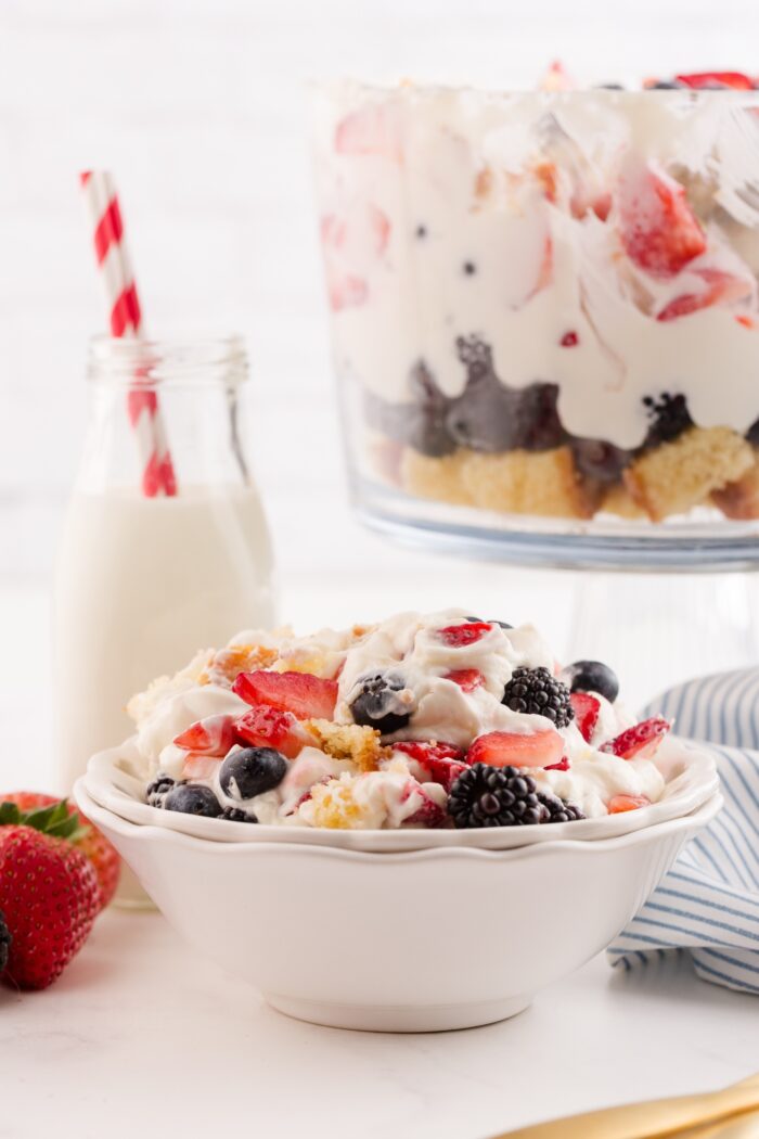 Red white and blue trifle scooped into a bowl.
