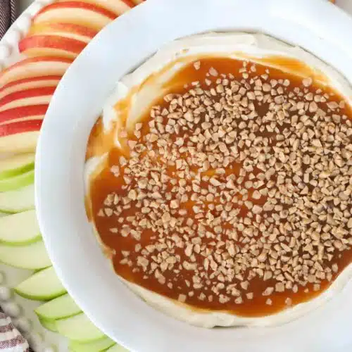 Top view of cream cheese, caramel, and toffee dip in a bowl.