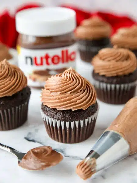 Nutella frosting piped on top of a chocolate cupcake.