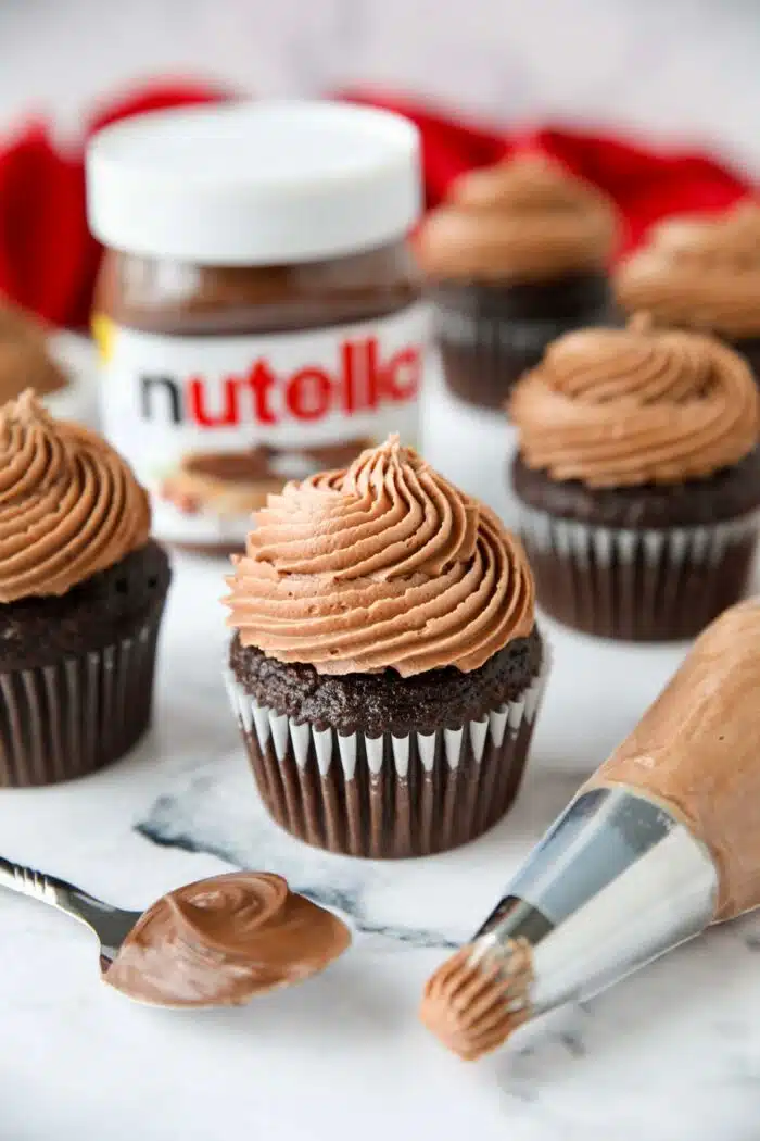Nutella frosting piped on top of a chocolate cupcake.