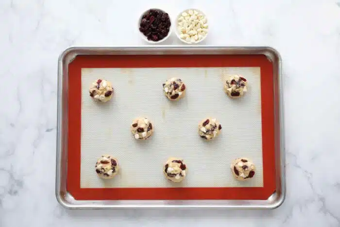 Cookie dough on a baking sheet.