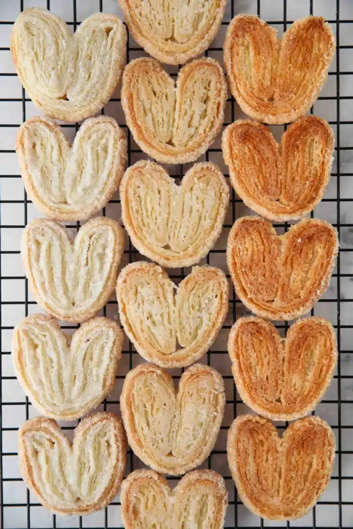 Color variations of palmier cookies from lightest to darkest based on baking method.