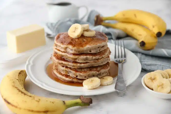 Stack of fluffy banana pancakes made with a pancake mix.