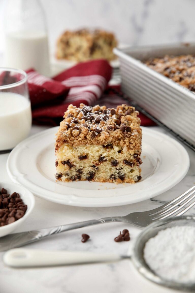 Square piece of chocolate chip coffee cake on a plate.