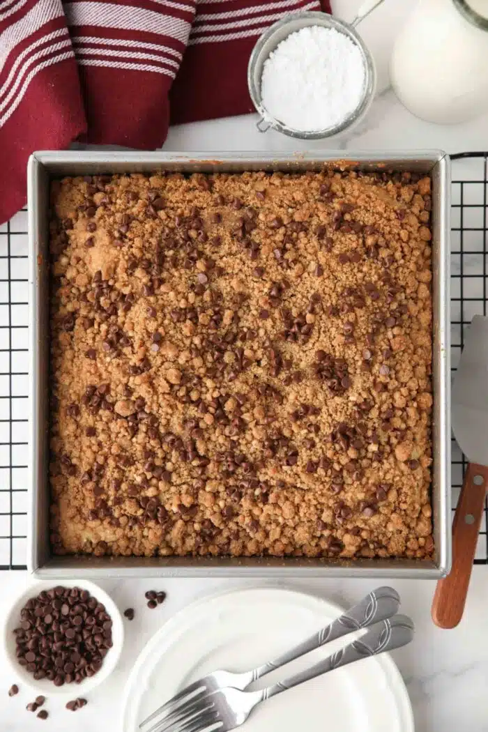 Top view of baked chocolate chip coffee cake in pan.