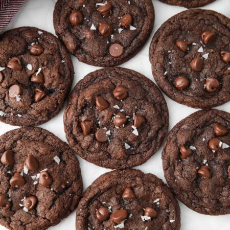 Top view of chocolate cookies with chocolate chips and sea salt.