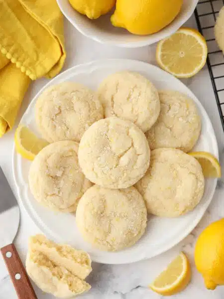 Lemon Cookies on a plate made like sugar cookies with lemon zest.