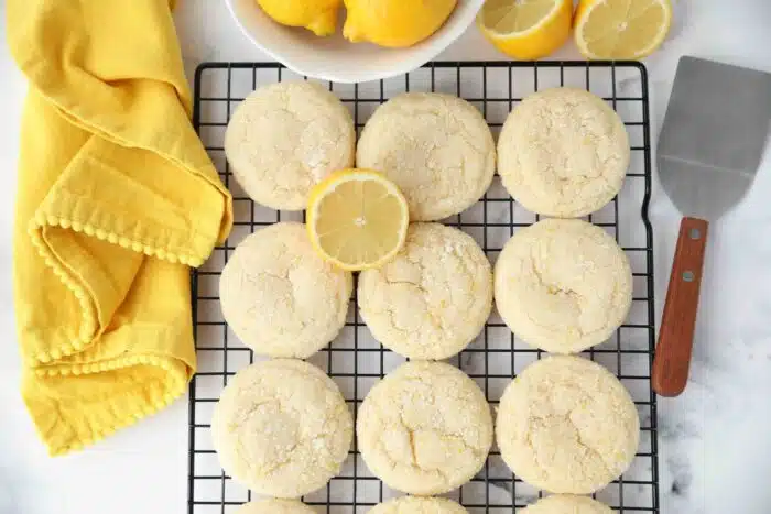 Lemon zest sugar cookies on a wire cooling rack.