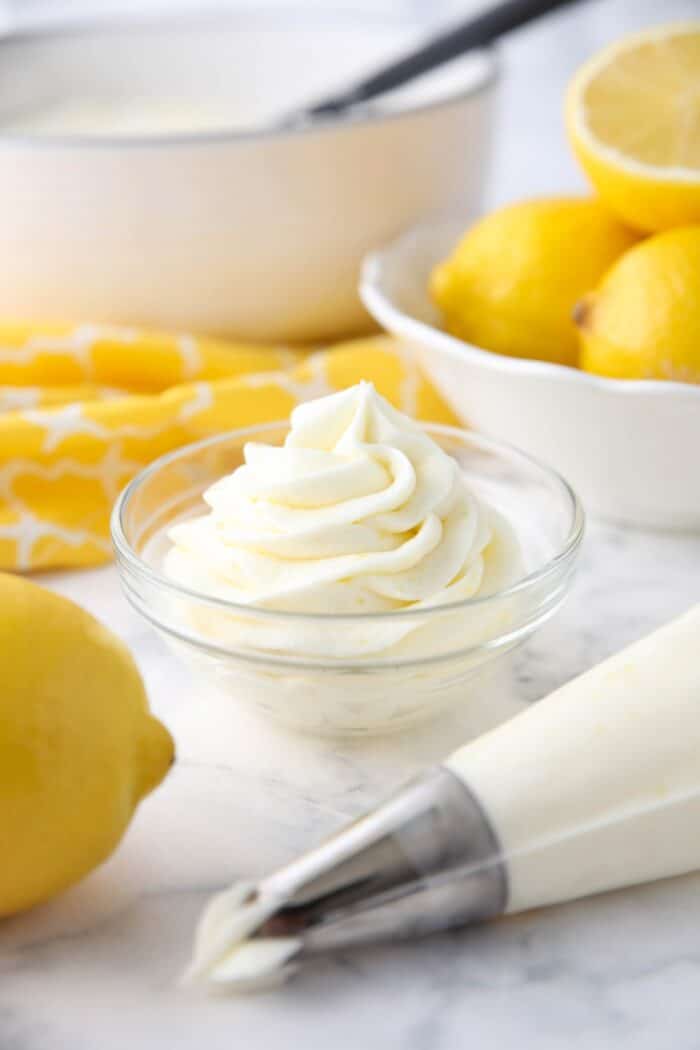 Lemon buttercream frosting piped into a small bowl.