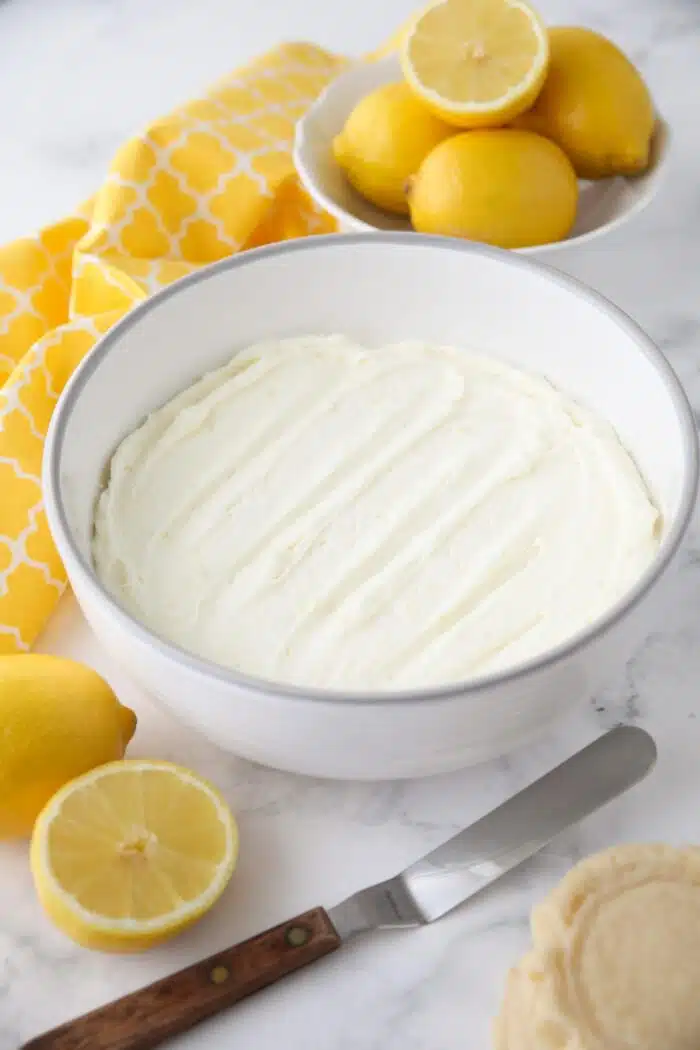 Lemon frosting in a large bowl.